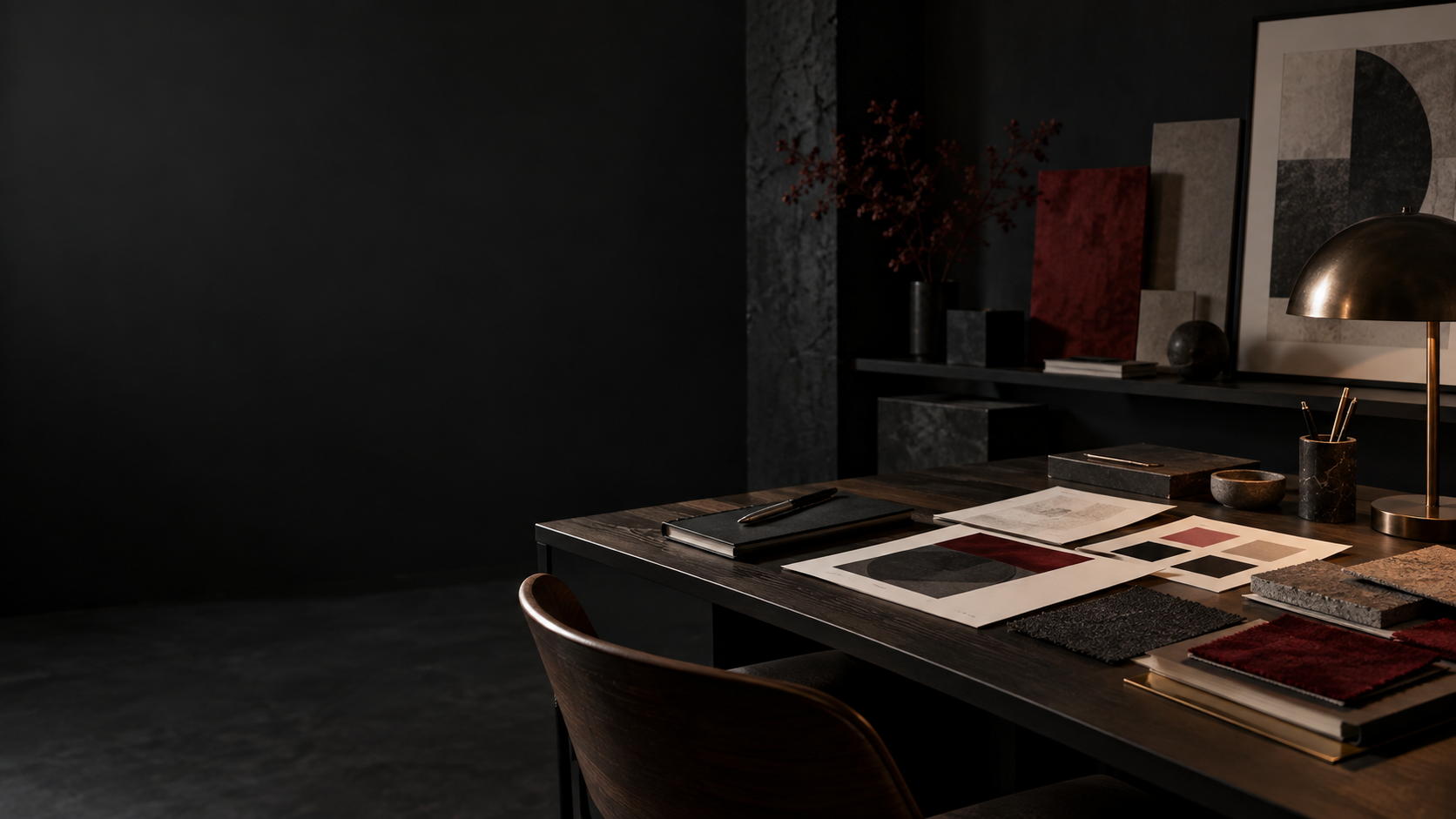 Creative studio with materials, type tests and color samples on a desk